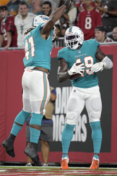 Thompson throws for 218 yards Dolphins hold off Bucs 26 24 AP News